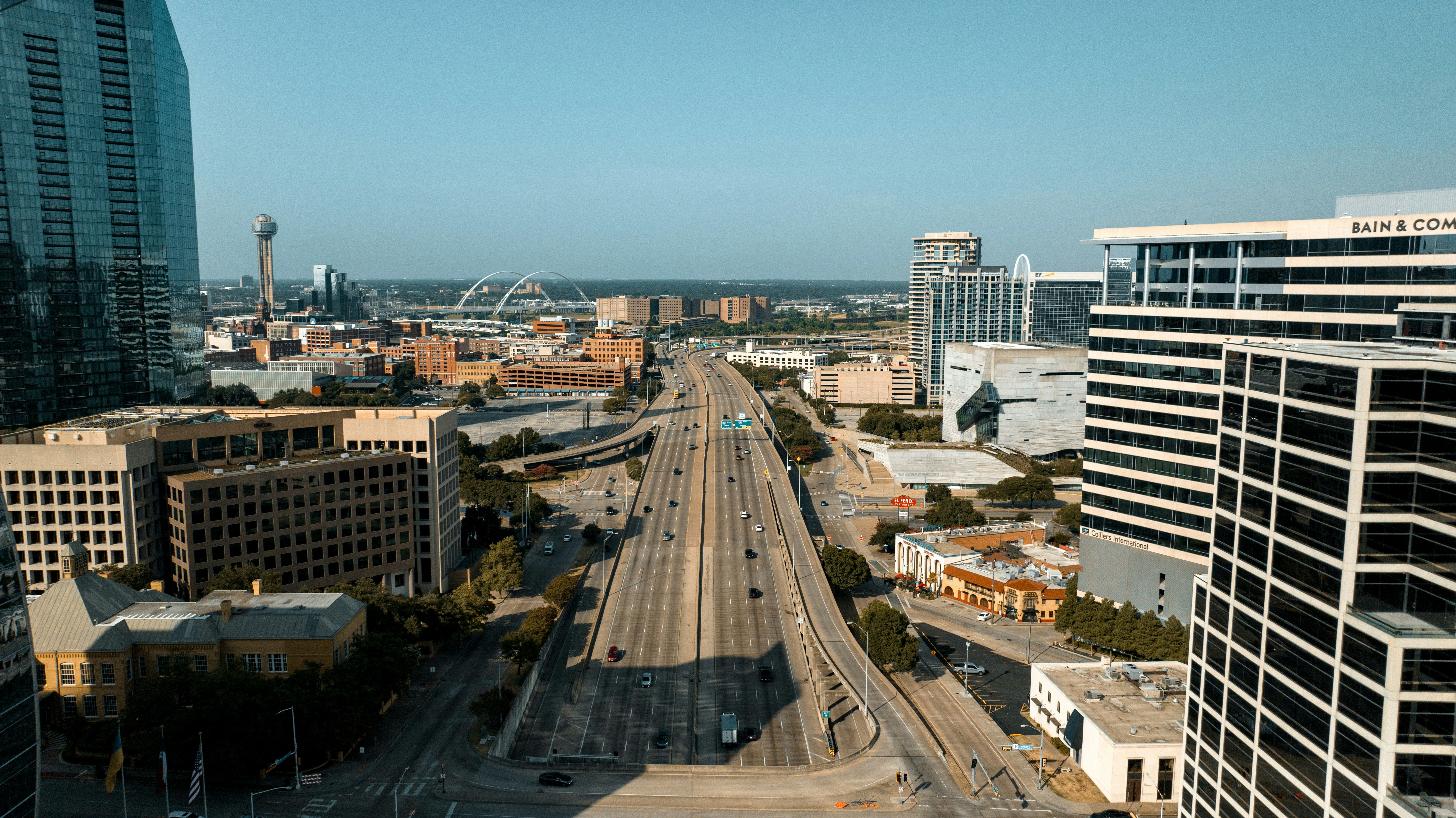 an aerial view of a city with tall buildings