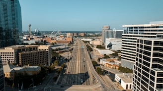 an aerial view of a city with tall buildings