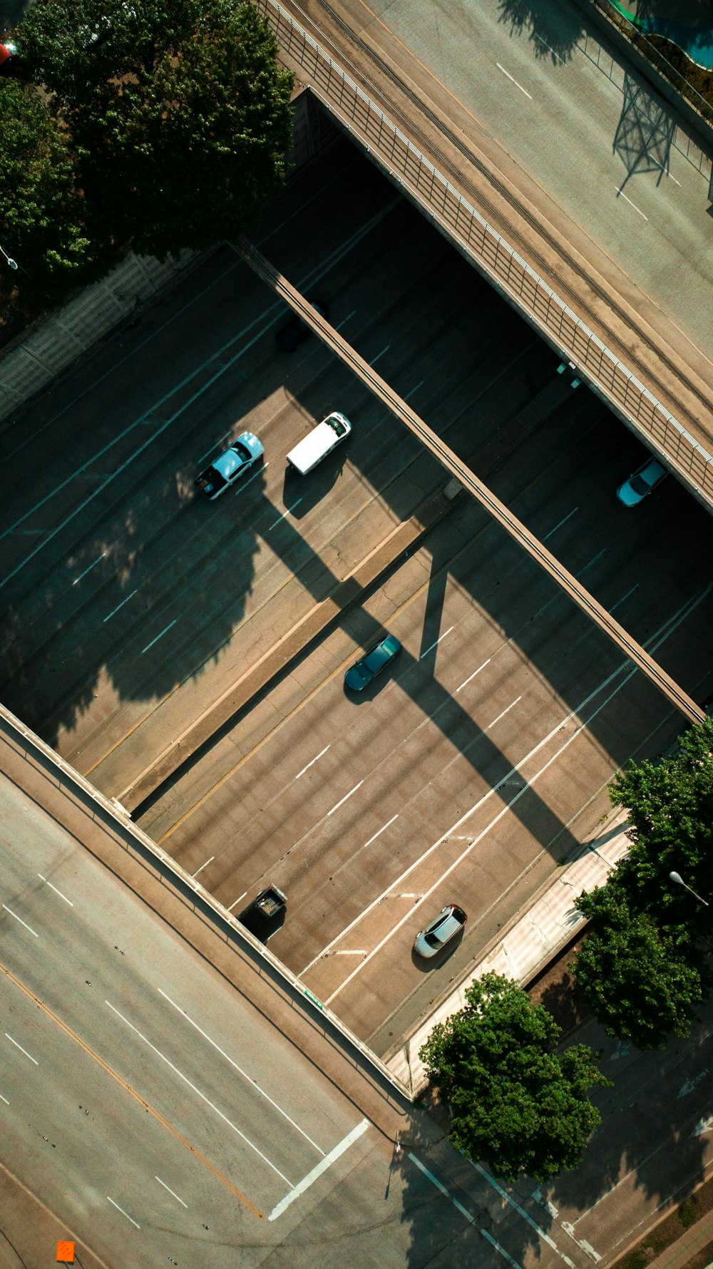 an overhead view of a parking lot with cars parked in it
