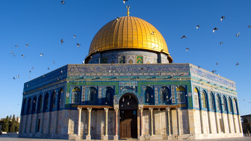 a large building with a golden dome on top of it