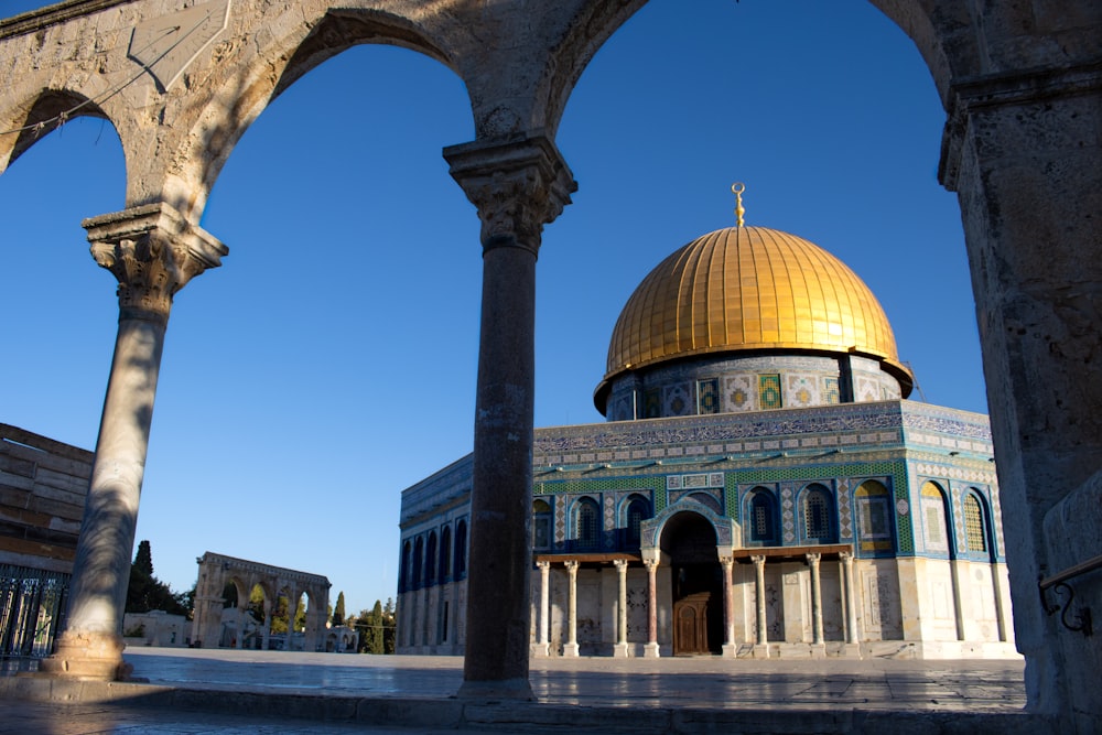 the dome of the rock in the middle of a courtyard