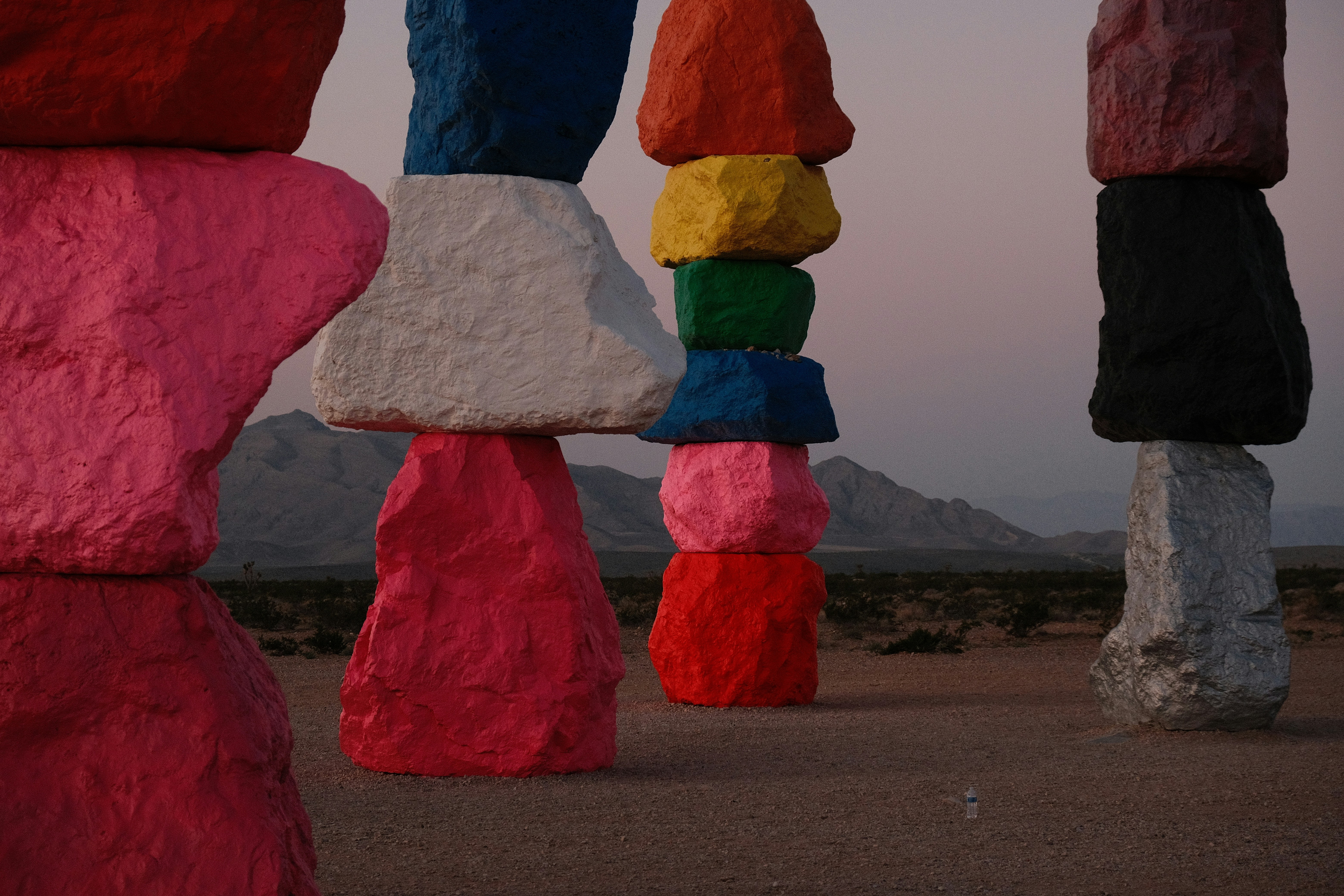 a group of large rocks sitting in the middle of a desert