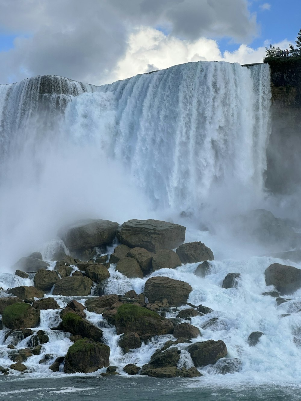 a large waterfall with water coming out of it