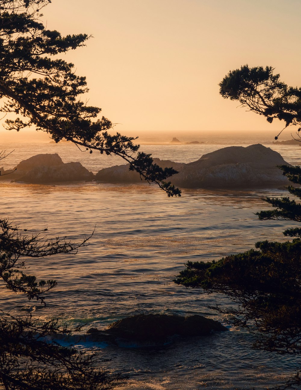 a view of a body of water at sunset