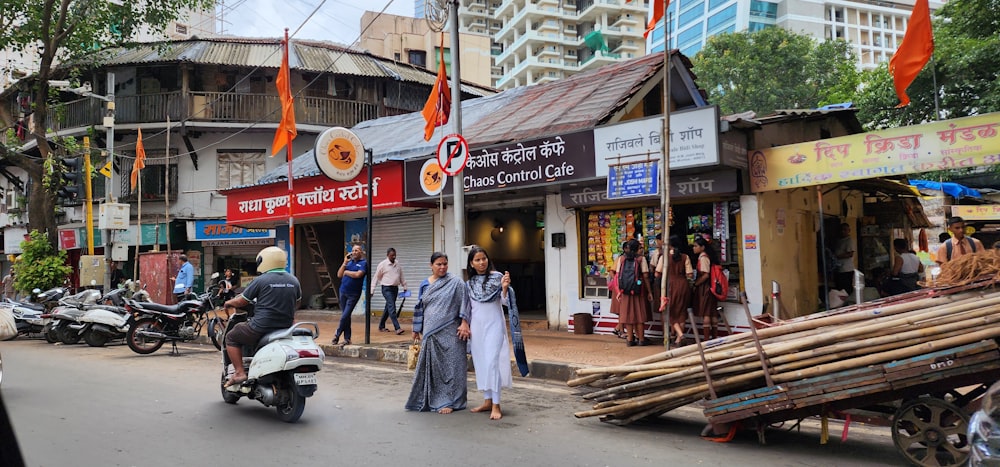 a group of people standing on the side of a road