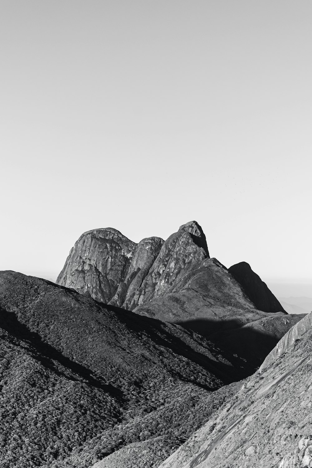 a black and white photo of a mountain range