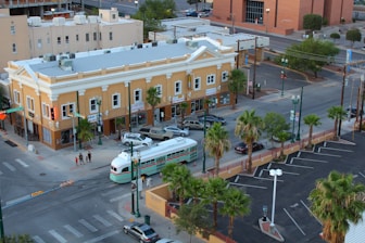 a city intersection with a bus and cars