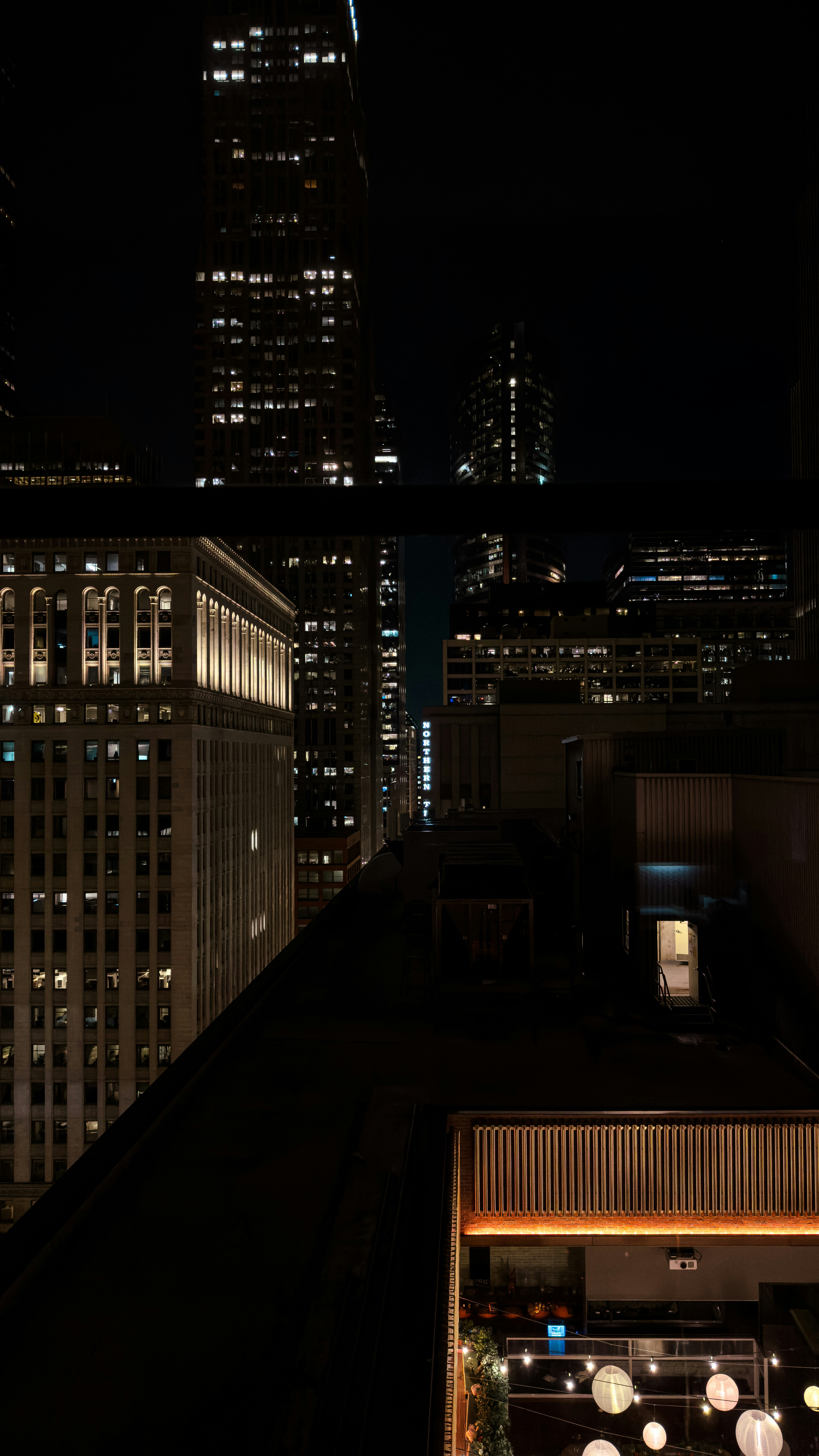 A view of a city at night from a rooftop photo – Free Wallpaper Image ...