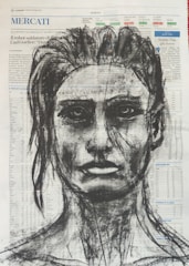 A charcoal drawing of a human face is superimposed over a page of a newspaper filled with text and numbers. The portrait features defined facial features, including intense eyes and a slightly parted lip expression. The background text is visible through the strokes of the charcoal drawing, adding a layered effect.