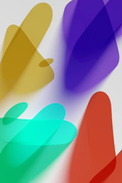 a group of different colored shapes on a white surface
