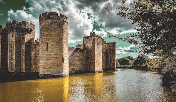 Ancient medieval castle surrounded by moats under a soft Danish sky in Salling.