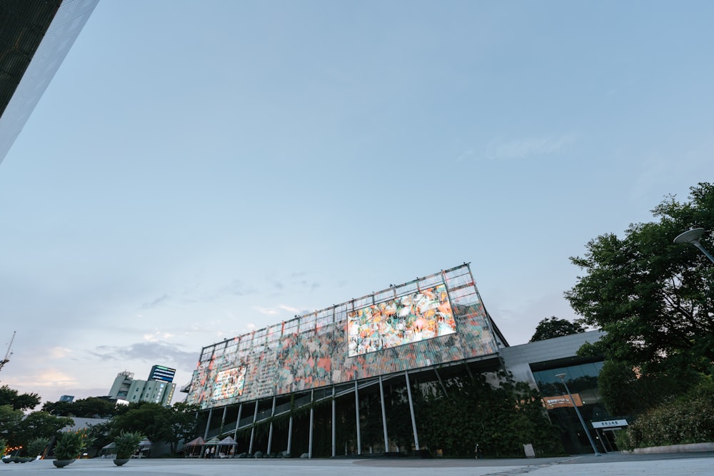 a tall building with a glass front and a lot of windows