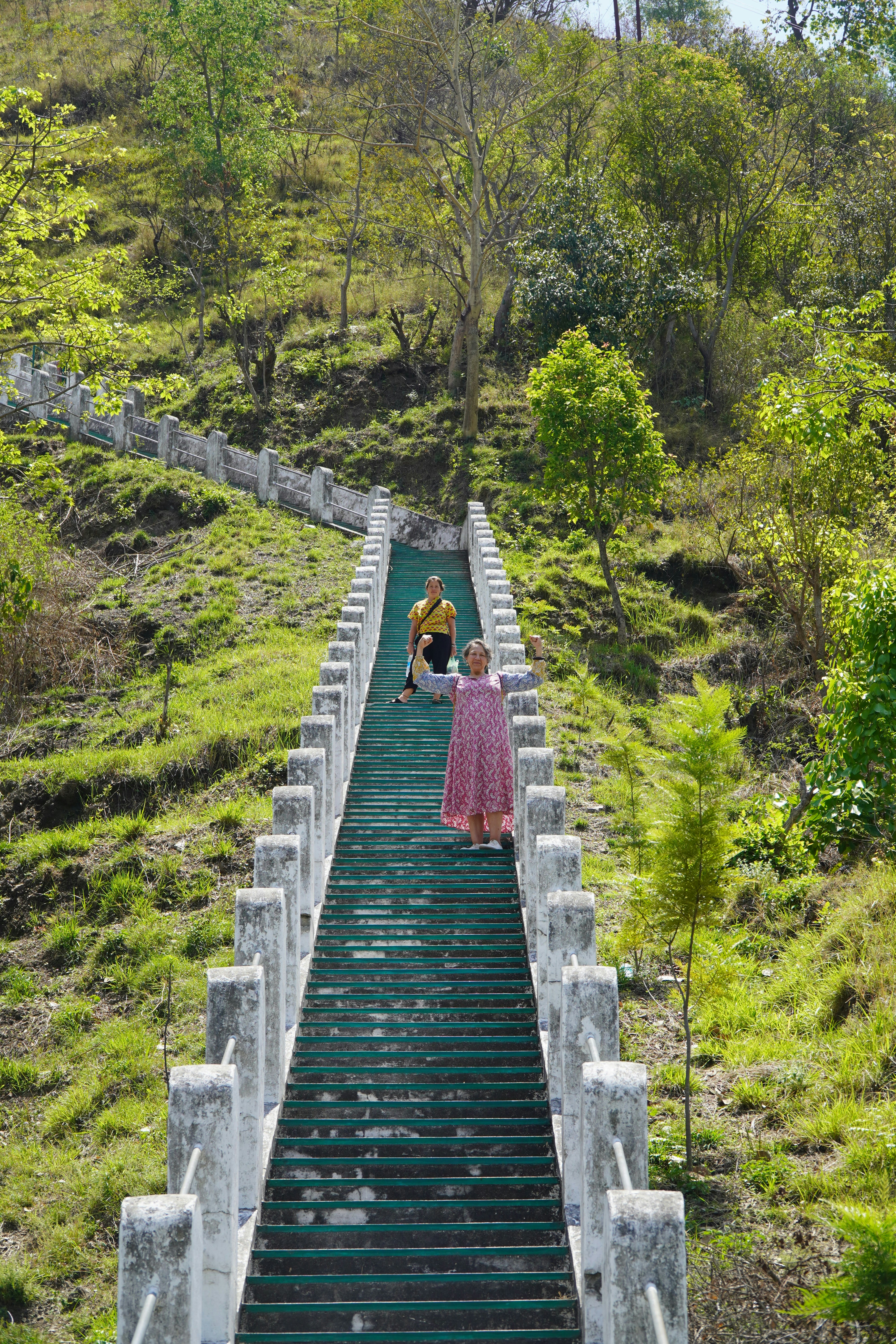 a couple of people that are walking down a set of stairs