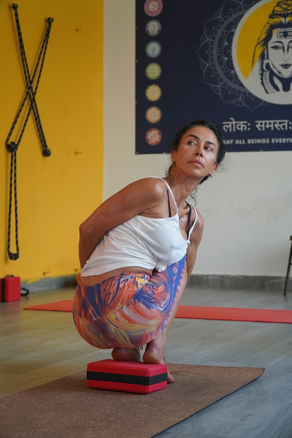 a woman doing a yoga pose on a mat