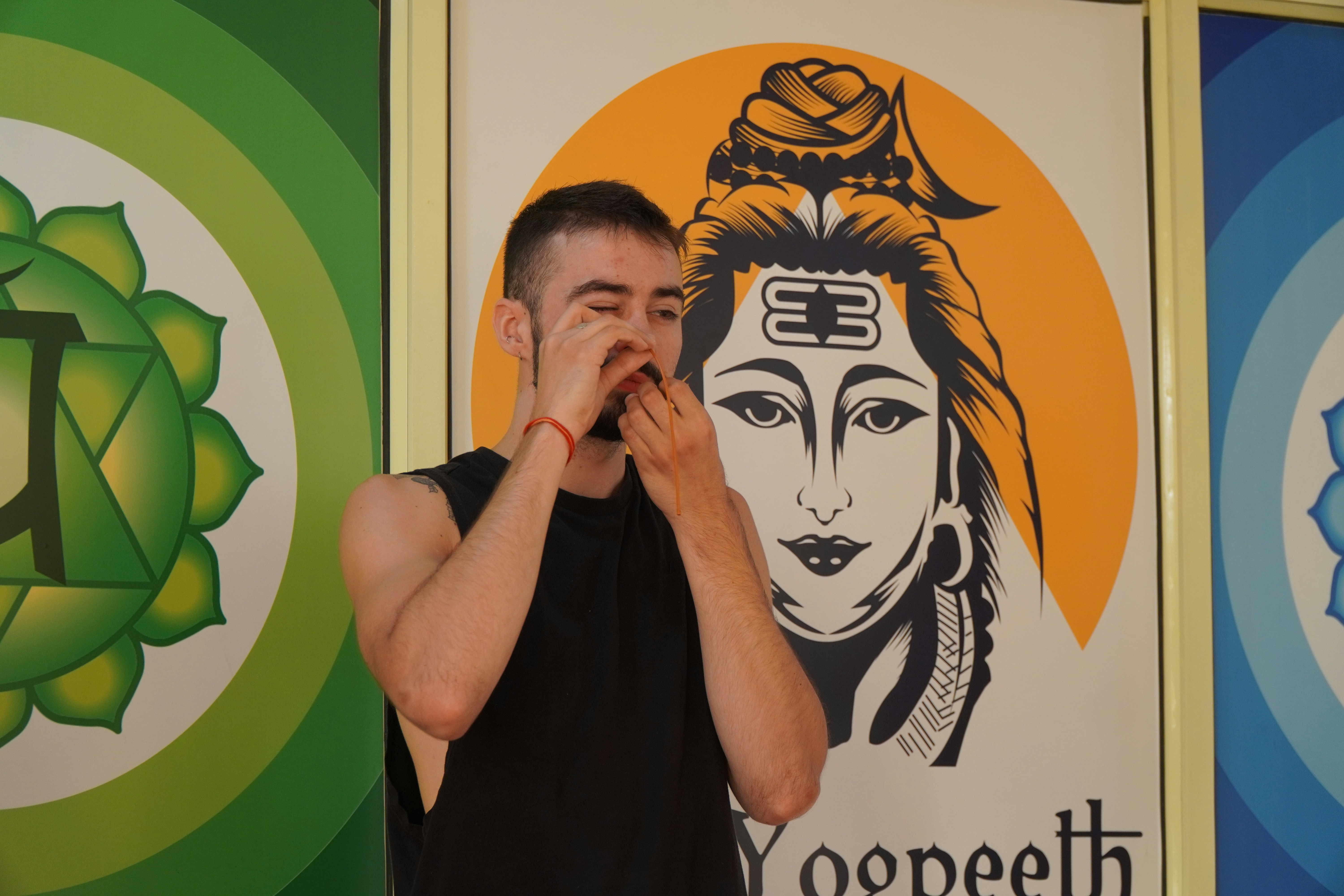 a man covering his face with his hands