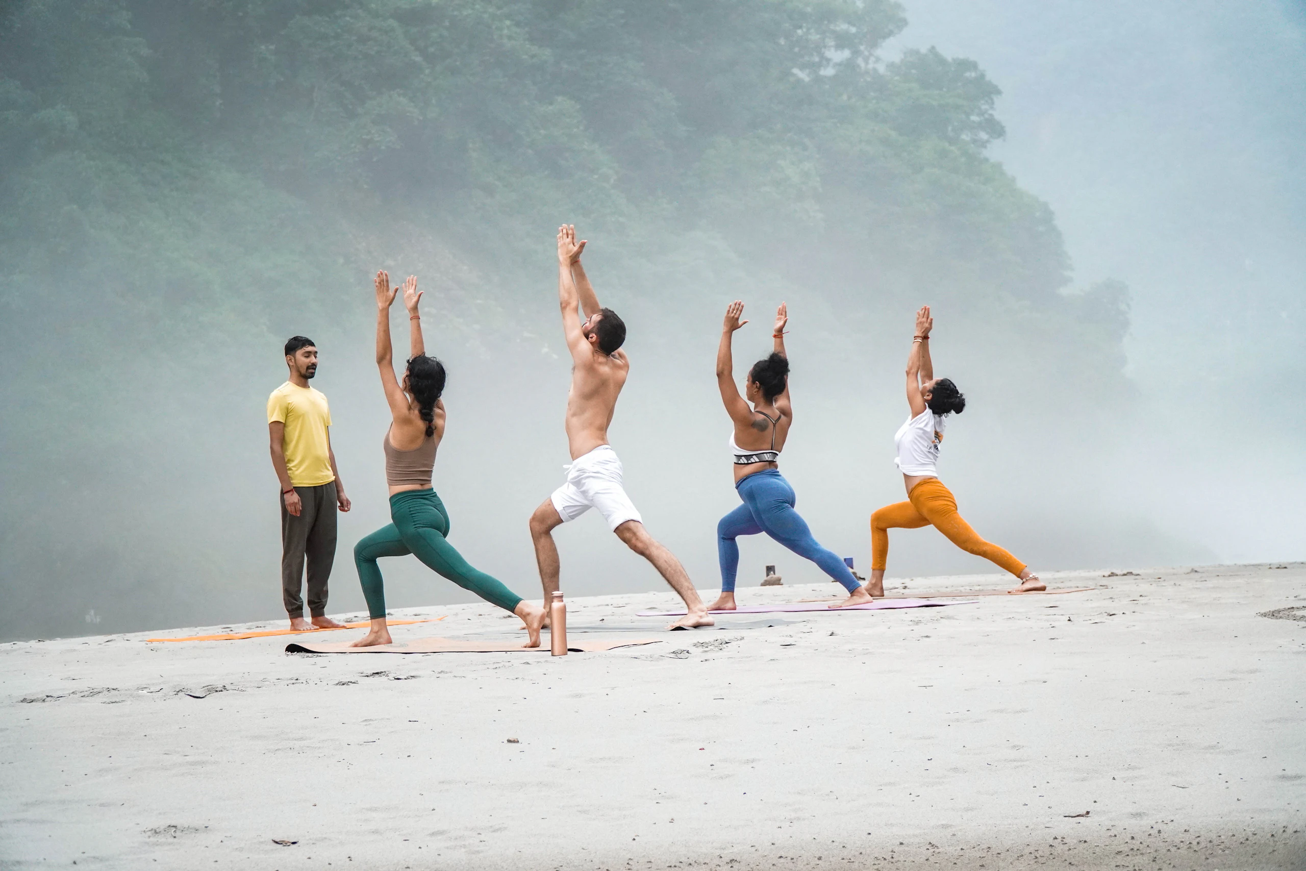 Group yoga on the beach