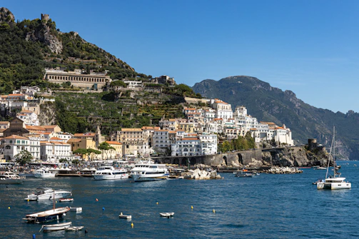 a group of boats floating on top of a body of water
