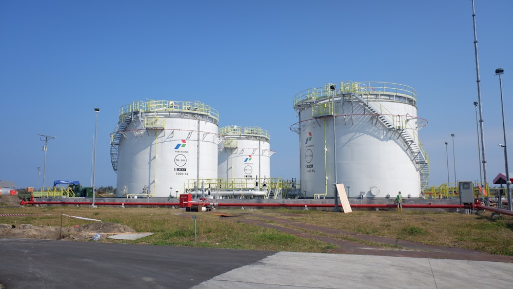 two large white tanks sitting next to each other