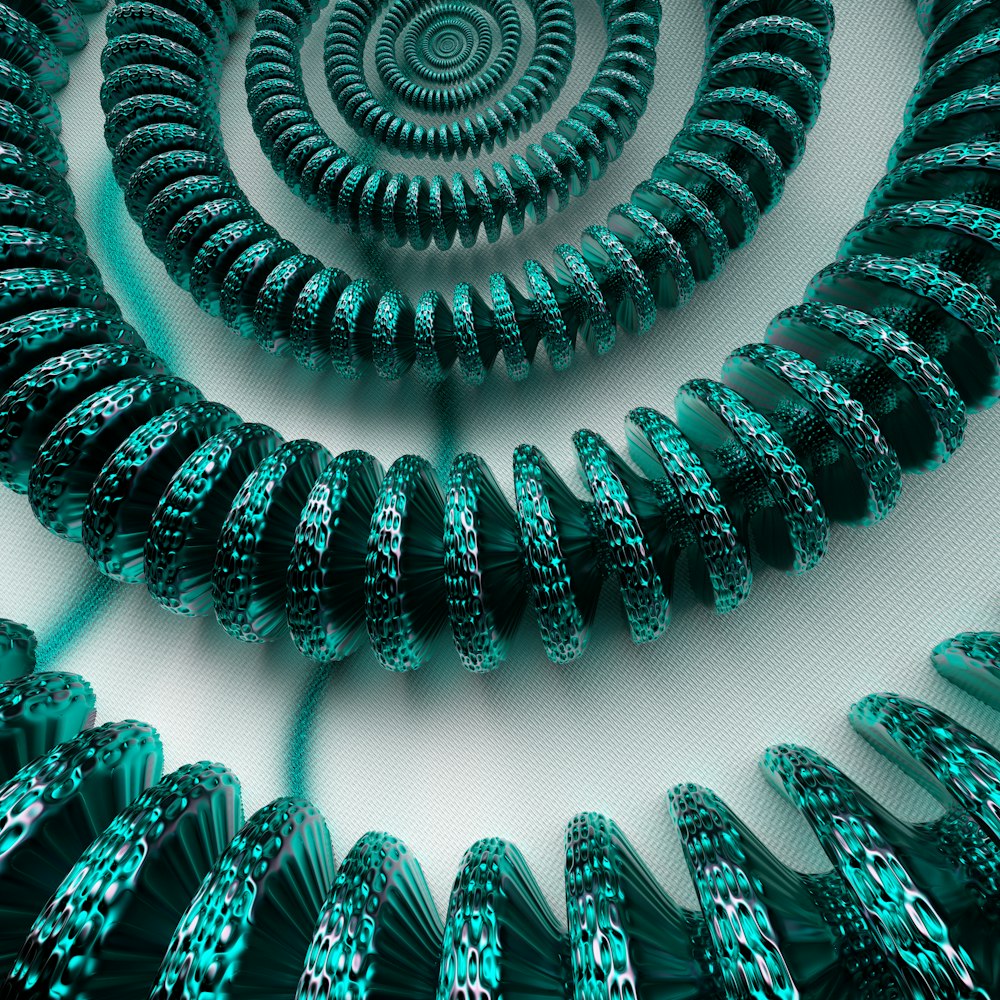 a group of green spirals on a white surface