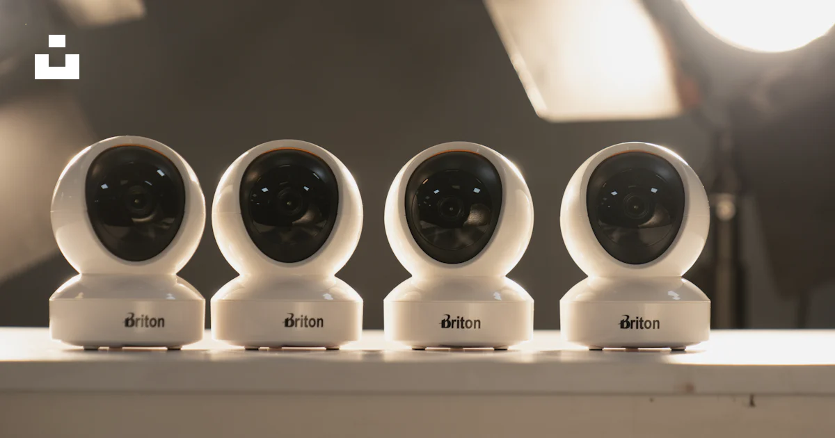 A group of three cameras sitting on top of a table photo – Free Camera ...