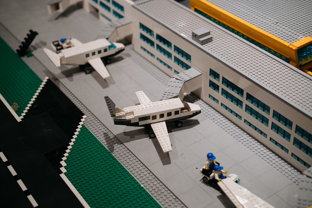 a lego model of an airport with a plane on the runway