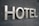 Large metallic letters spelling 'HOTEL' are mounted on a textured dark surface.