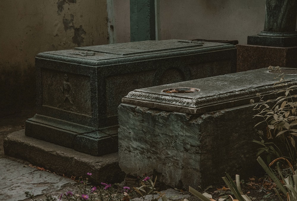 a couple of stone benches sitting next to each other