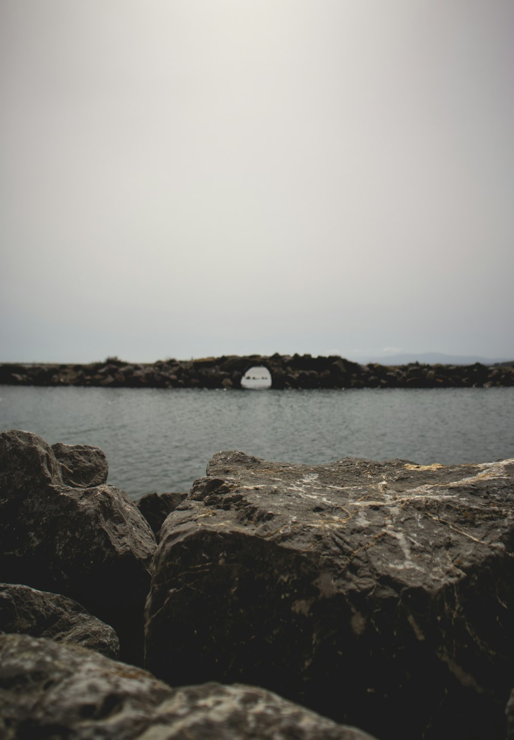 a large body of water surrounded by rocks