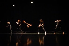 Close-up of dancers' feet mid-movement during an intense choreography session