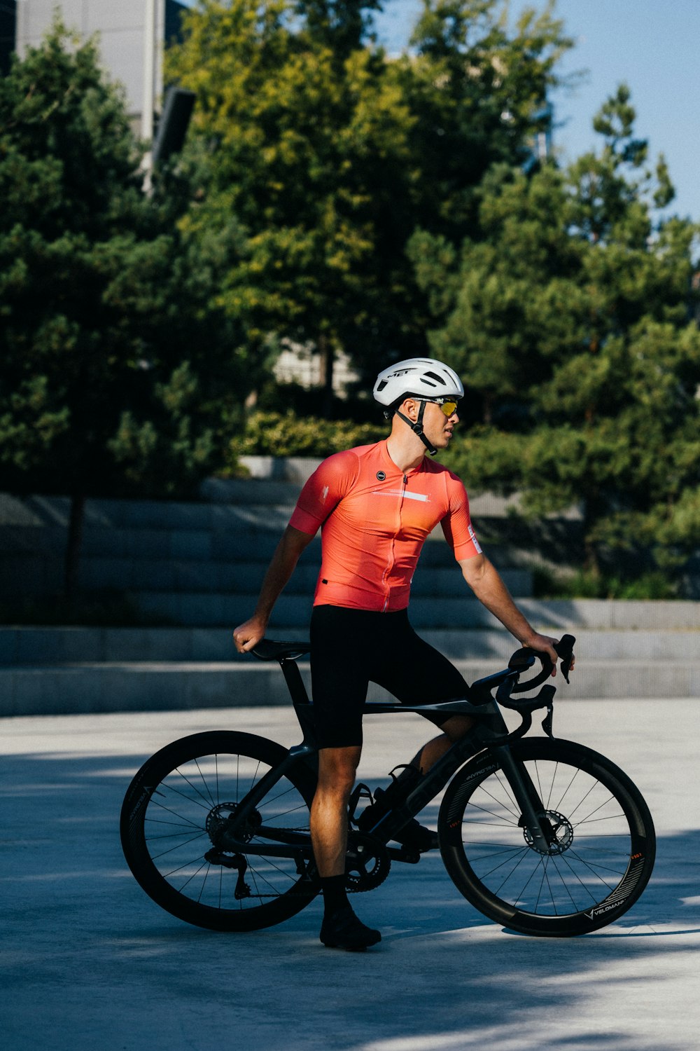 a man riding a bike down a street