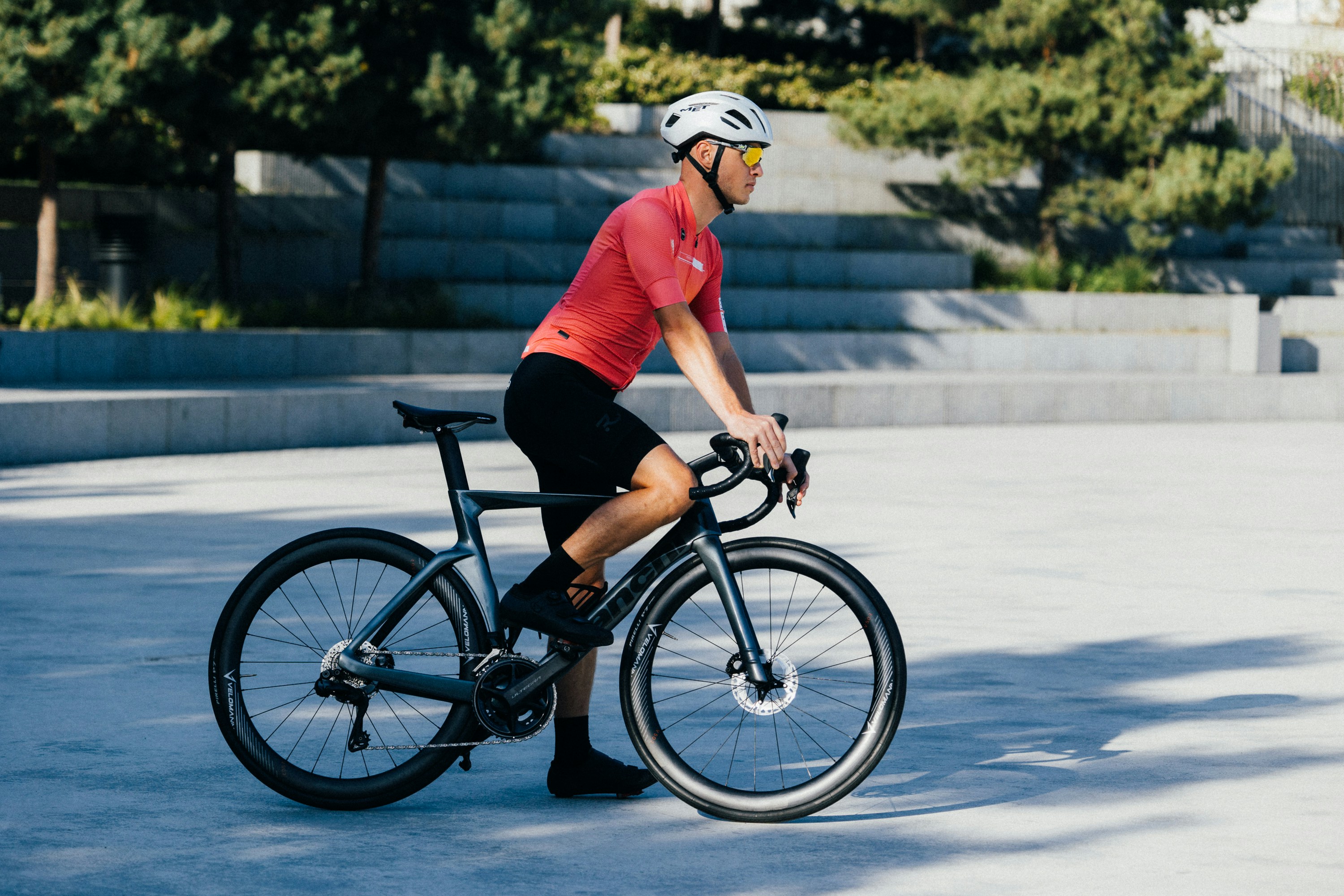a man riding a bike in a parking lot