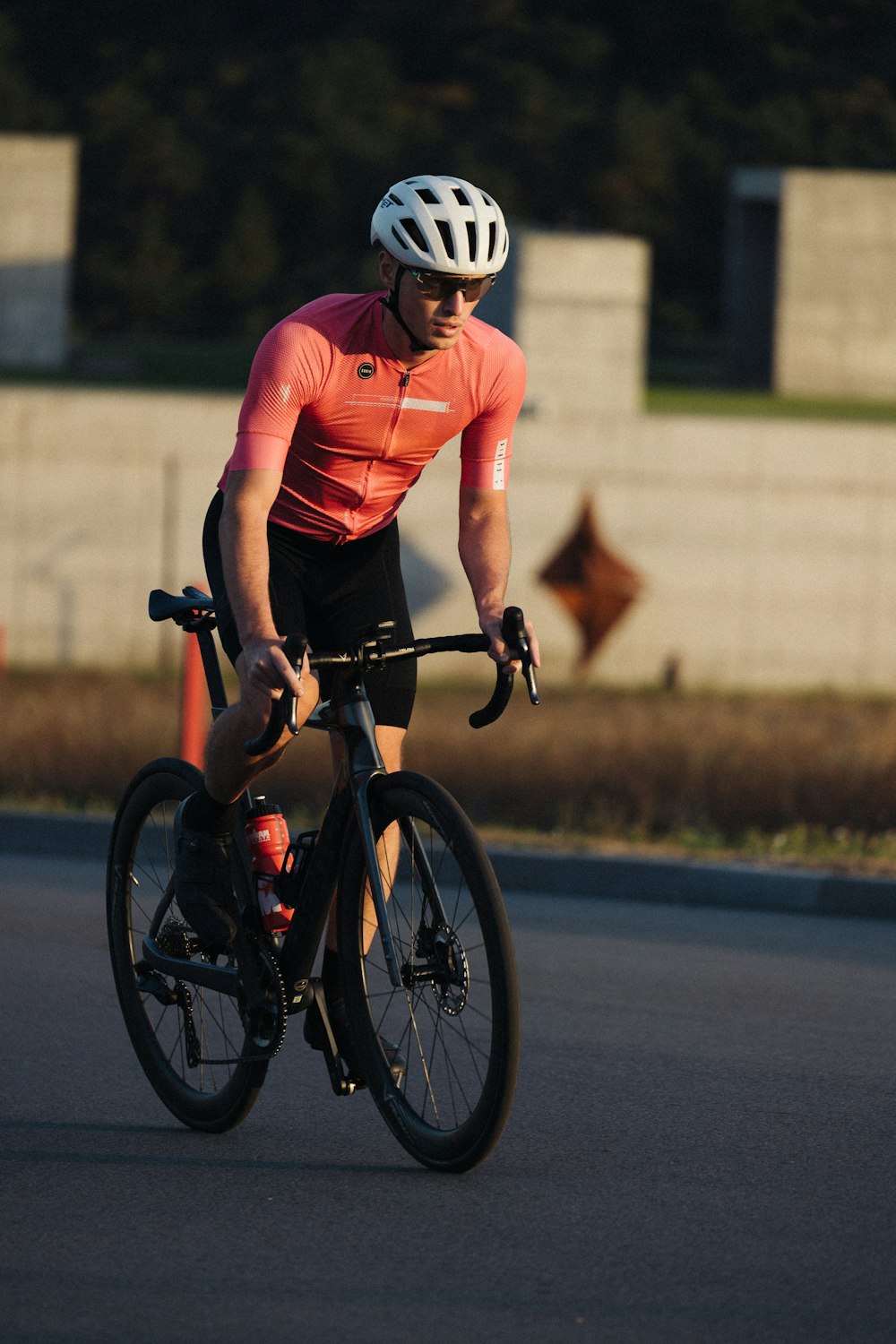 a man riding a bike down a street