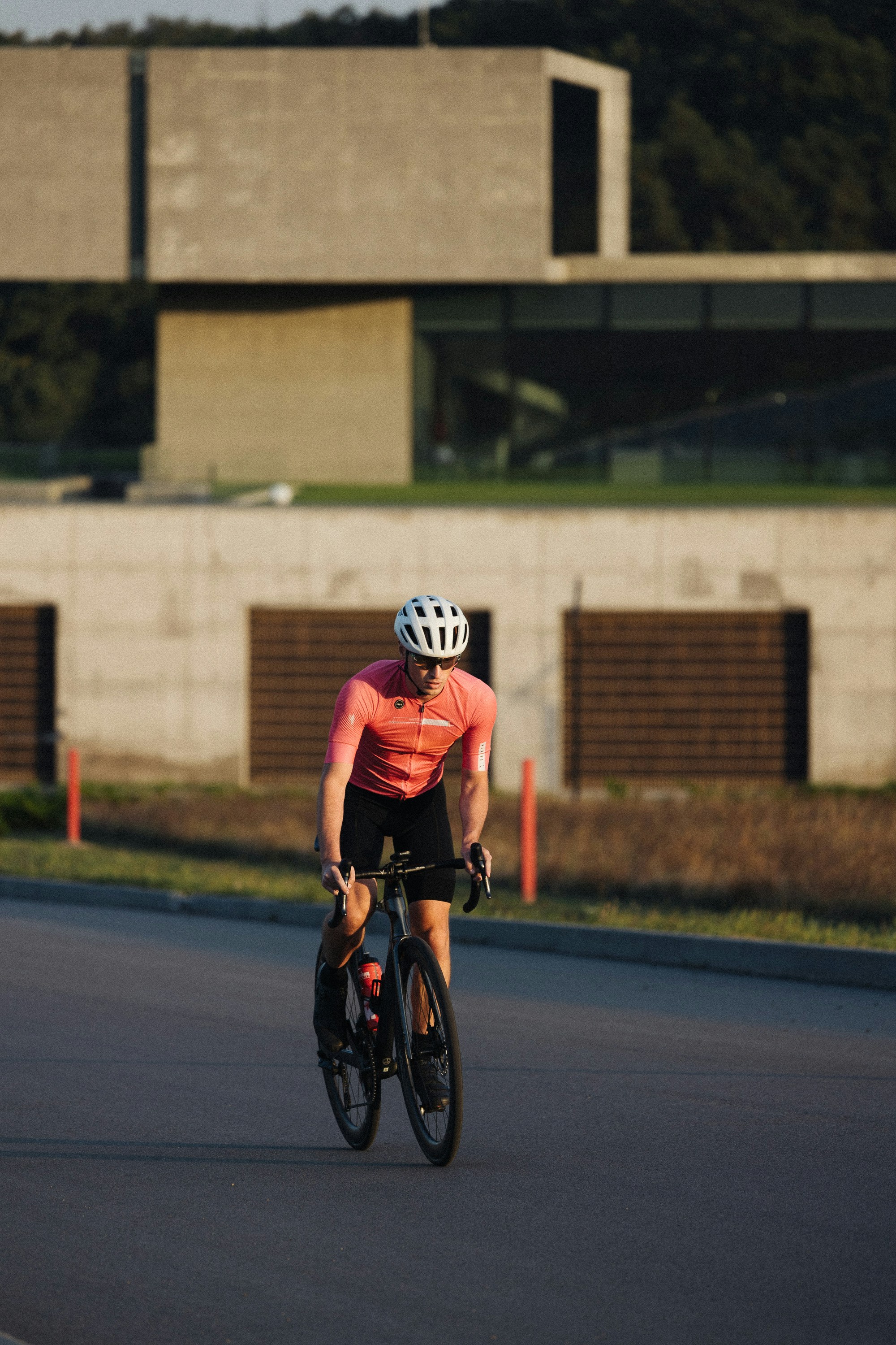 a man riding a bike down a street