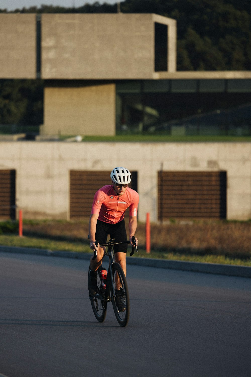 a man riding a bike down a street