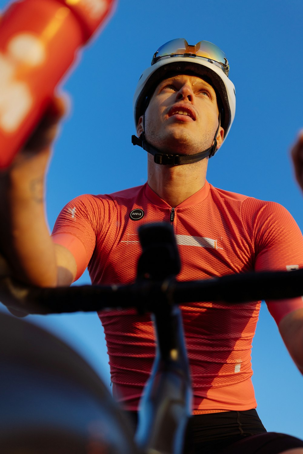 a man wearing a helmet while riding a bike
