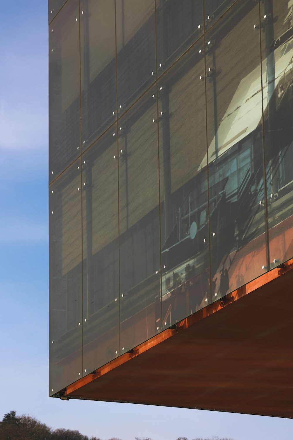 a reflection of a building in the glass of another building