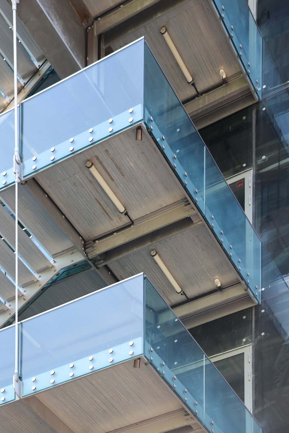 a close up of a building with glass balconies