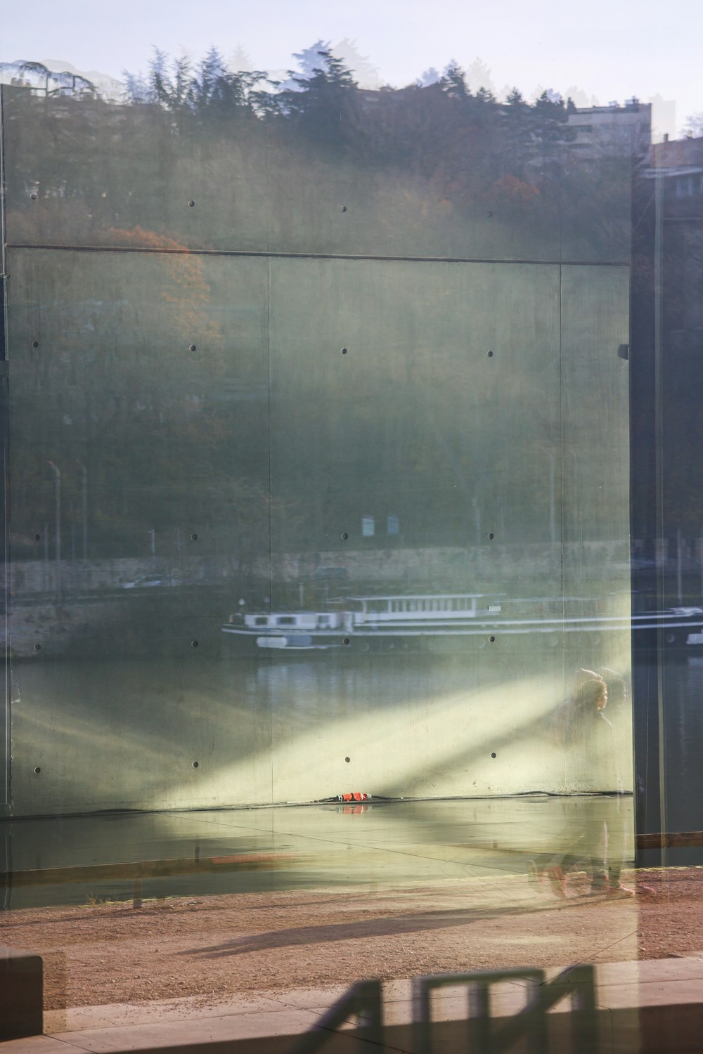 a reflection of a building in a window