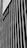 A black and white vertical striped wall features a sign with the word 'Netflix'. The stripes create a striking pattern and the sign is placed at an angle, adding depth to the image.
