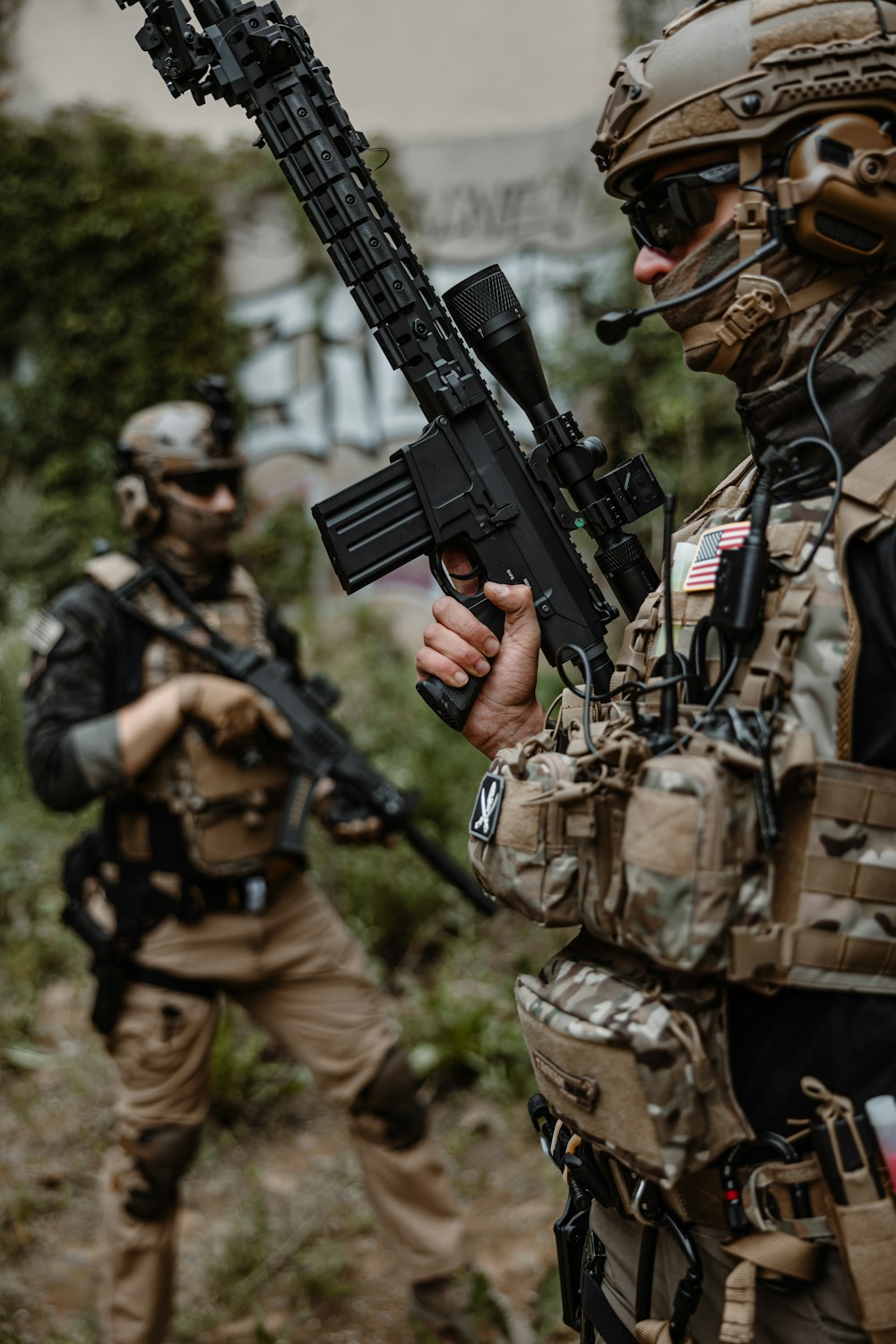 a couple of men with guns in their hands