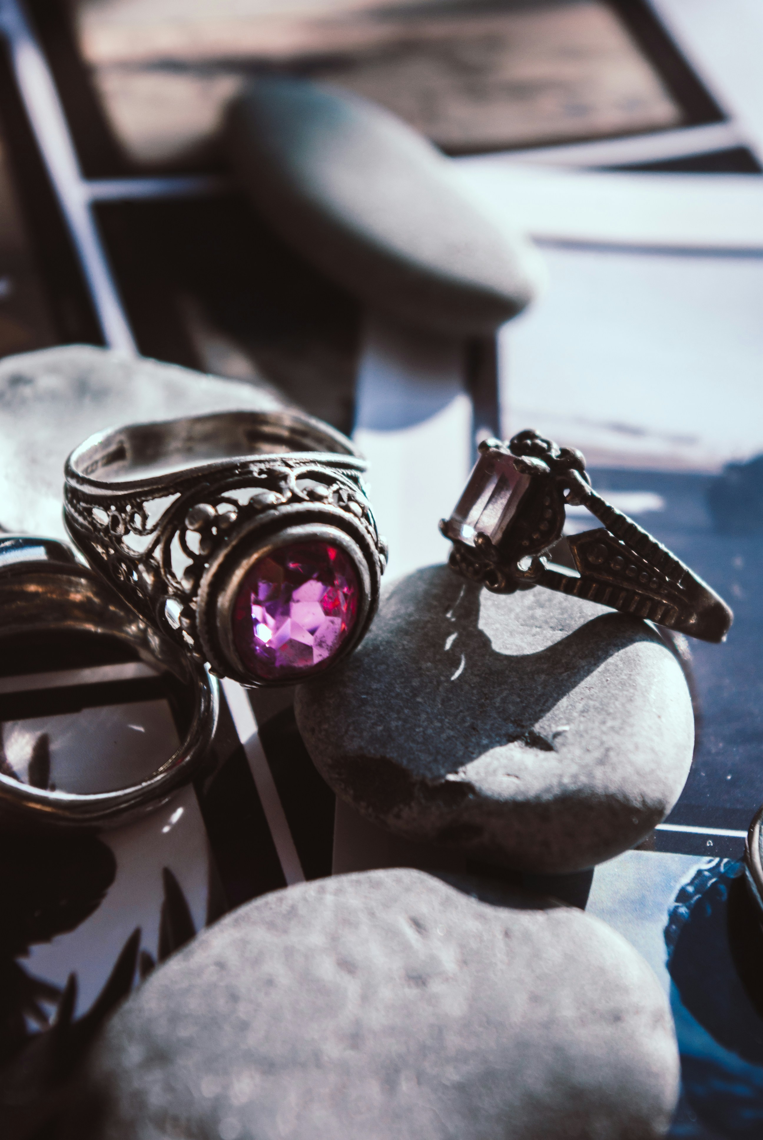 a couple of rings sitting on top of a rock