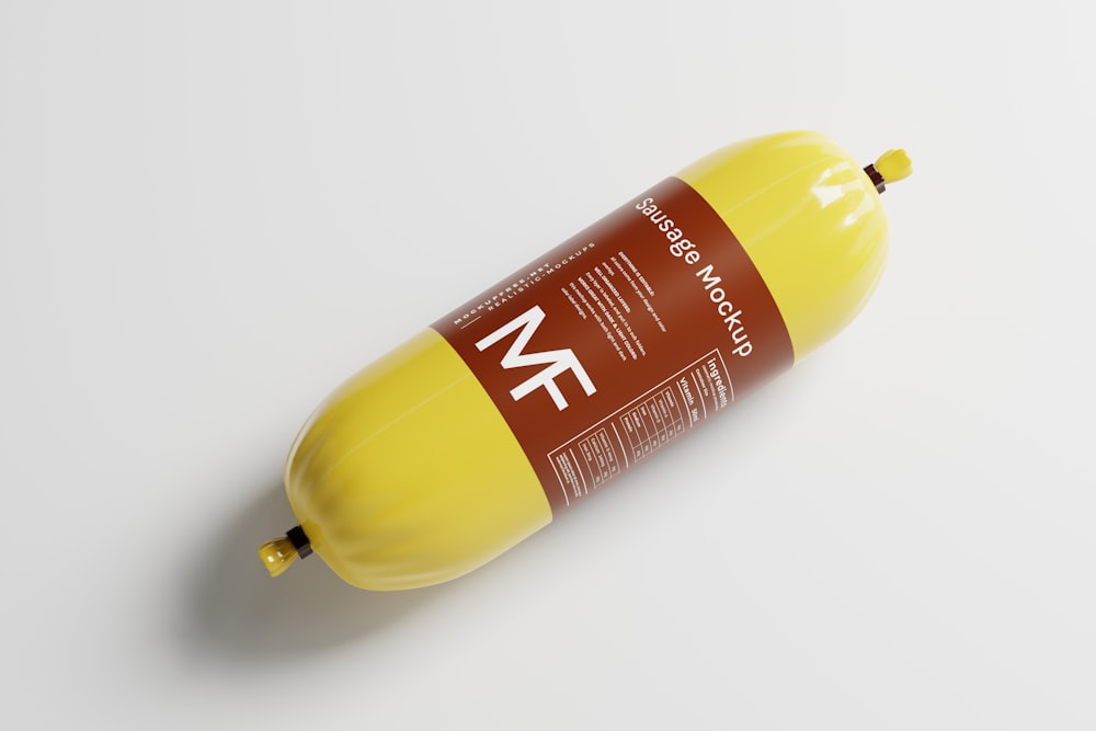 a tube of mustard sitting on top of a white table