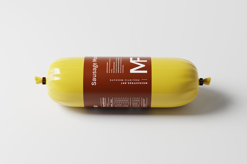 a bottle of mustard sitting on top of a white table