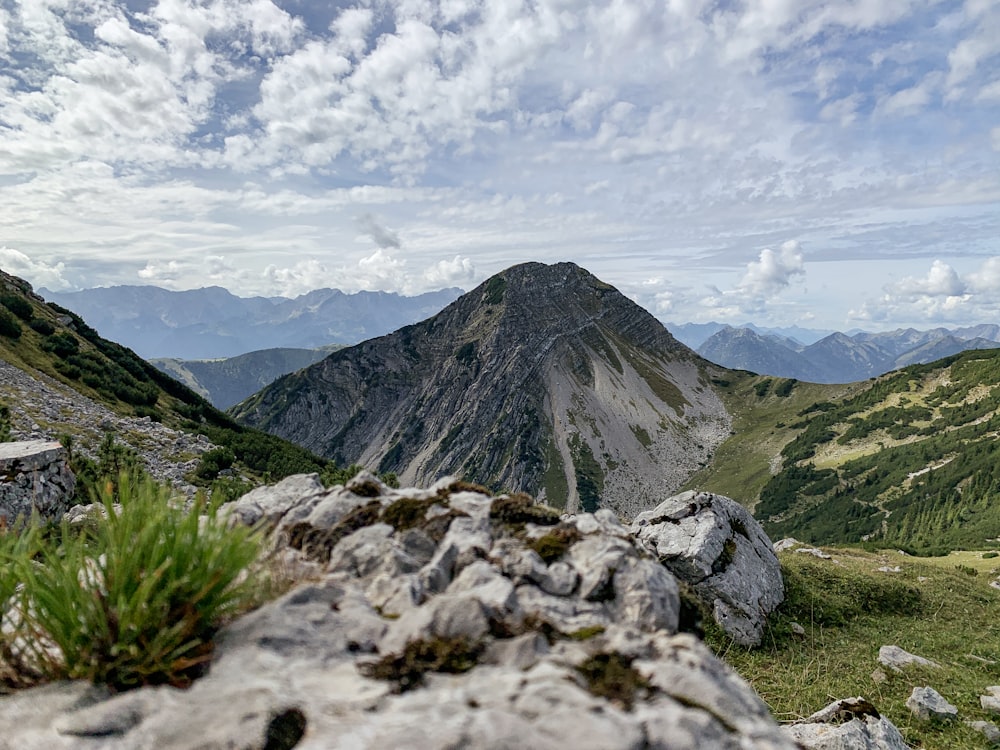 a view of a mountain range from a rocky outcropping