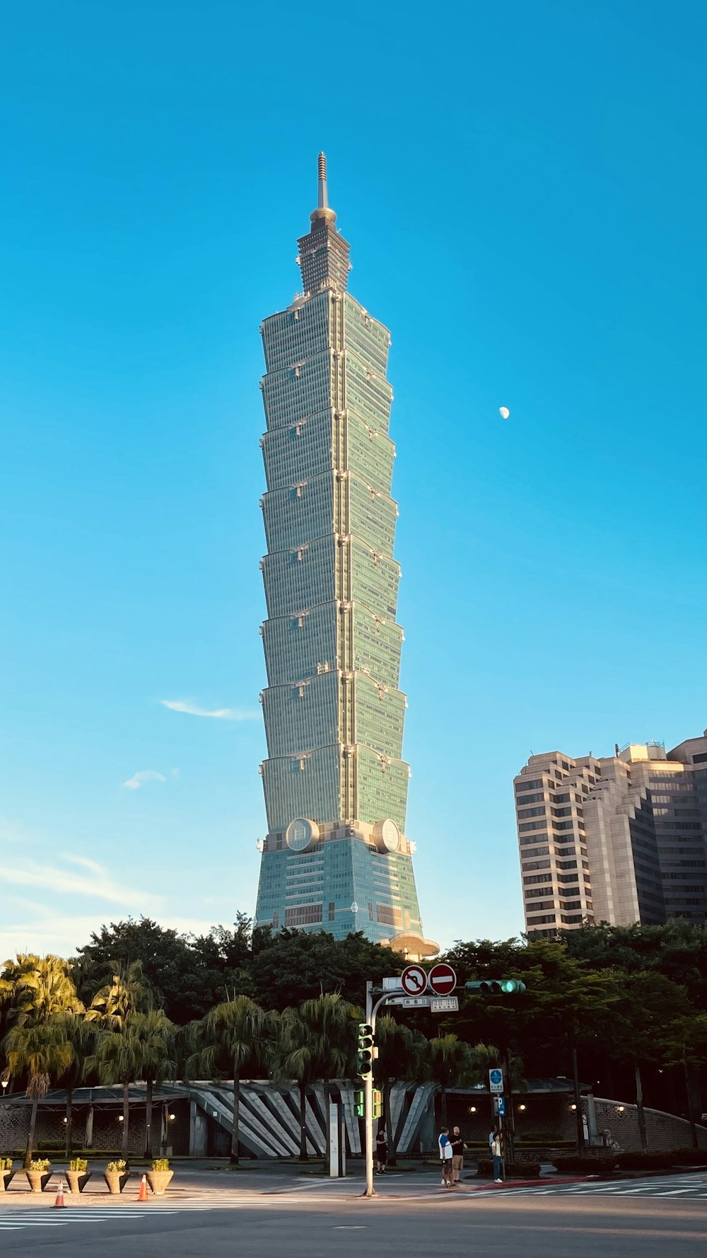a tall building with a sky scraper in the background