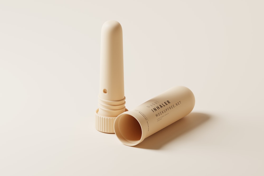 a tube of lip bale sitting on a white surface