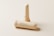 A nasal inhaler with its cap removed is displayed against a minimalist, light background. The inhaler is cylindrical and features text that reads 'Nasal Inhaler' along with a website address. The design emphasizes a clean and modern aesthetic.