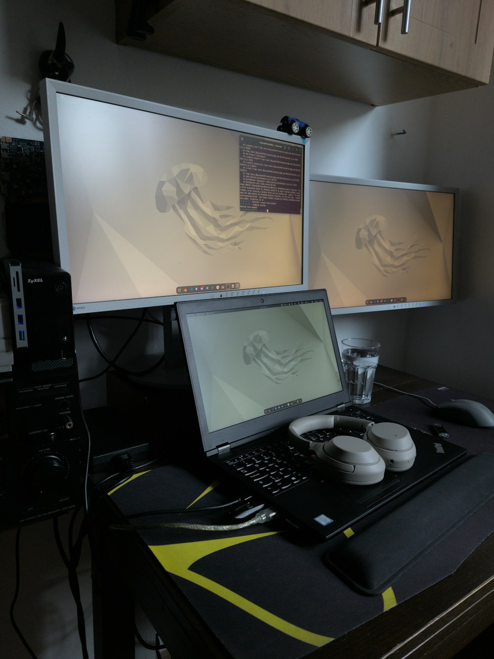 a laptop computer sitting on top of a desk