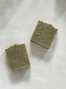 Close-up of a sleek, handcrafted soap bar with natural textures and subtle city-inspired patterns.