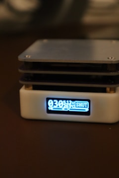 Front view of a compact currency counting machine with digital screen